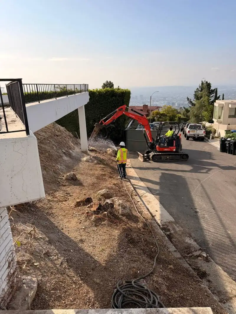 Dust control with water during concrete demolition