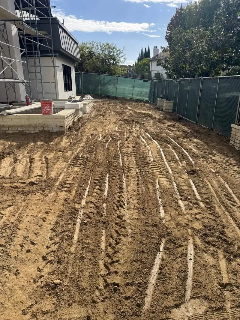 Lot graded beside new construction