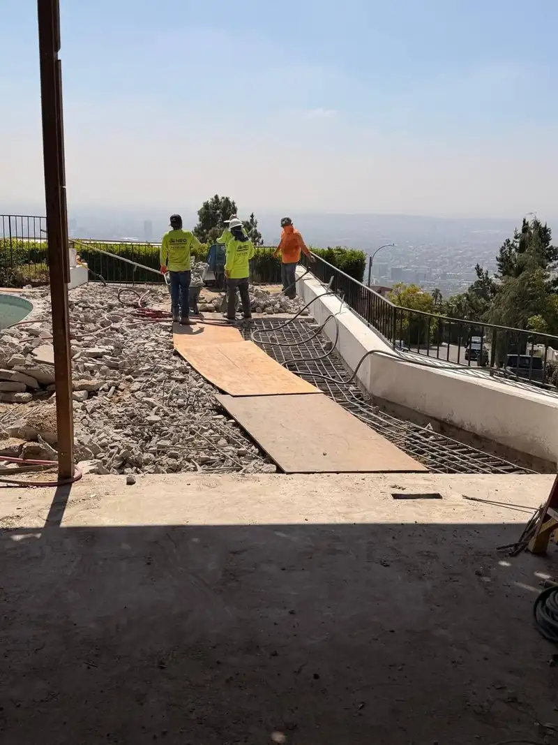 NEO crew on a hillside pool deck job